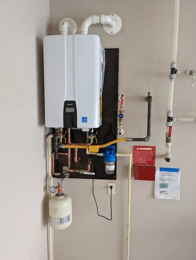 Professional plumber installing copper piping in a Nitro home